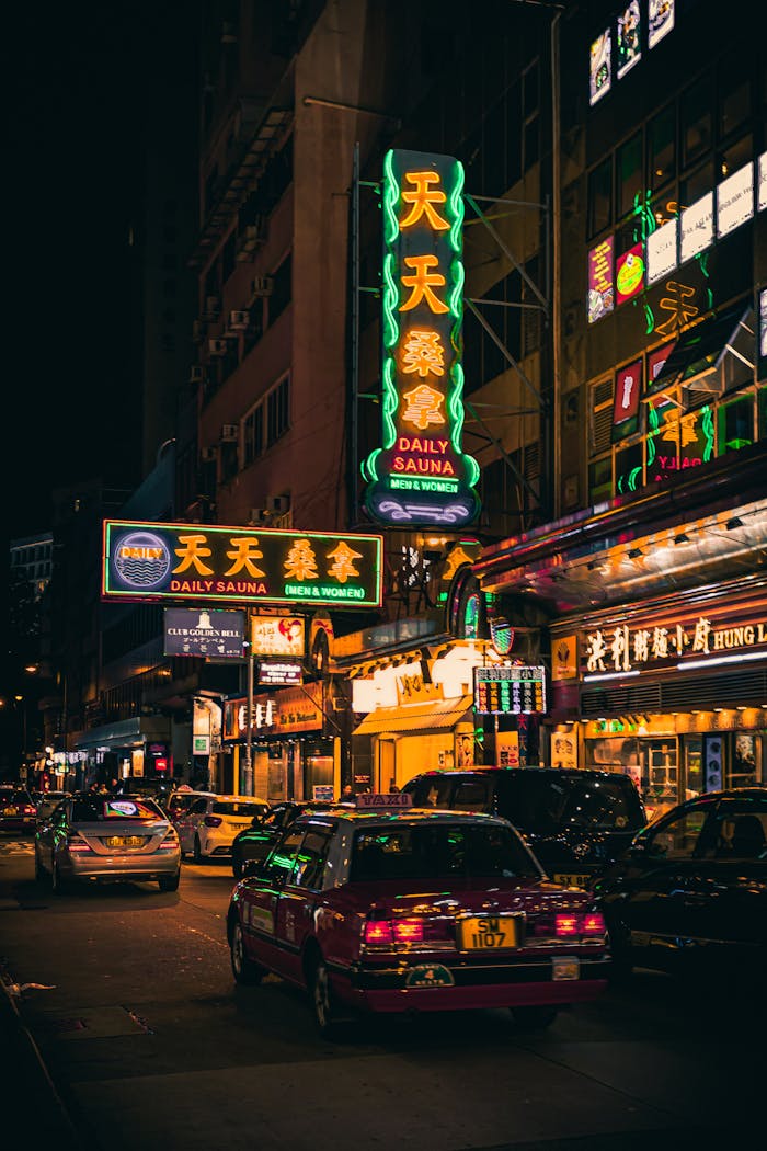 Home Exploring the vibrant nightlife of Hong Kong with neon signs illuminating the busy streets.